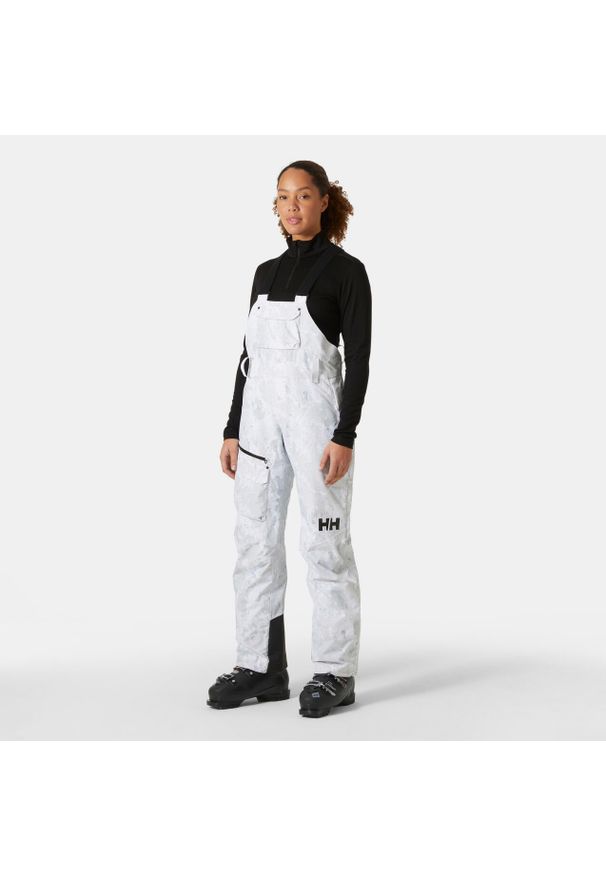 Damskie spodnie narciarskie na szelkach Helly Hansen Powderqueen. Kolor: szary. Sezon: zima. Sport: narciarstwo