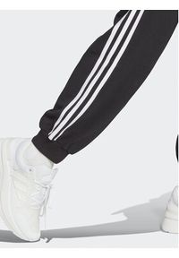 Adidas - adidas Spodnie dresowe Essentials 3-Stripes French Terry Loose-Fit Joggers HA4375 Czarny Loose Fit. Kolor: czarny. Materiał: bawełna