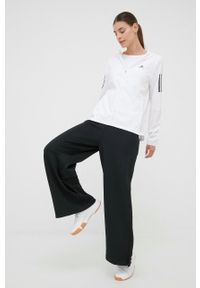 Adidas - adidas spodnie dresowe damskie kolor czarny szerokie high waist. Stan: podwyższony. Kolor: czarny. Materiał: dresówka