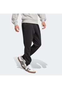 Adidas - Spodnie dresowe męskie ADIDAS Essentials Feelcozy. Materiał: dresówka. Sport: joga i pilates