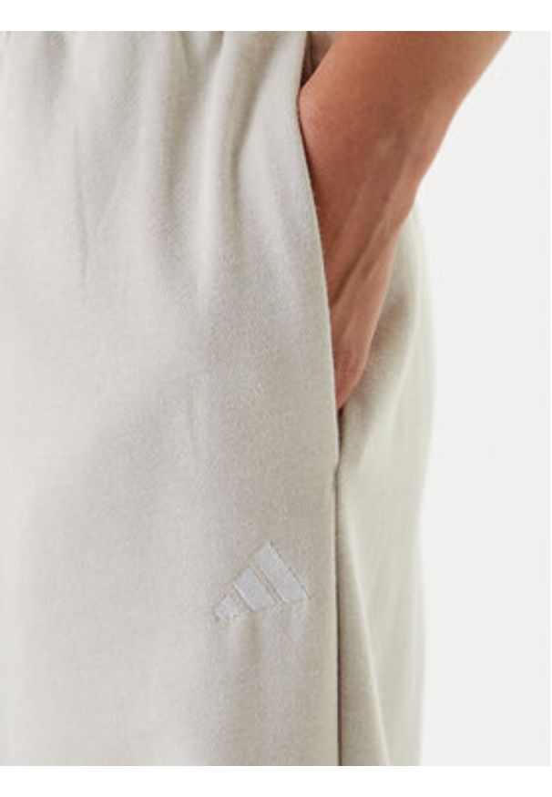 Adidas - adidas Spodnie dresowe Essentials Small Logo Feel Cozy JC5922 Beżowy Regular Fit. Kolor: beżowy. Materiał: bawełna, syntetyk