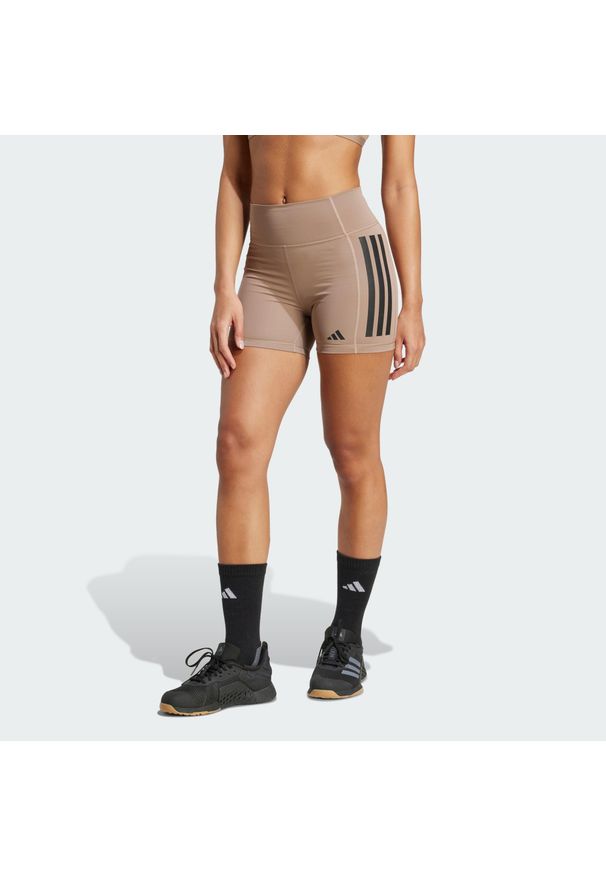 Adidas - Legginsy Optime 3-Stripes 1/4 Short. Kolor: brązowy. Materiał: materiał. Technologia: ClimaCool (Adidas). Długość: krótkie