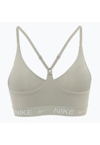 Biustonosz treningowy Nike Dri-Fit Indy Light Support. Kolor: beżowy. Technologia: Dri-Fit (Nike)
