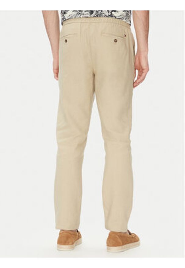 TOMMY HILFIGER - Tommy Hilfiger Spodnie materiałowe Harlem MW0MW38801 Beżowy Slim Fit. Kolor: beżowy. Materiał: len