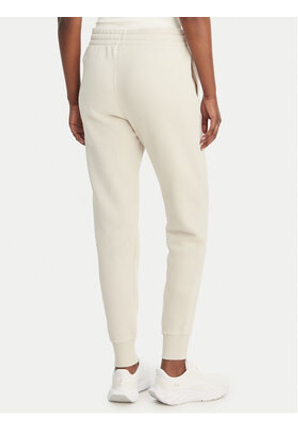 Under Armour Spodnie dresowe UA Icon Fleece 6001537 Beżowy Slim Fit. Kolor: beżowy. Materiał: bawełna