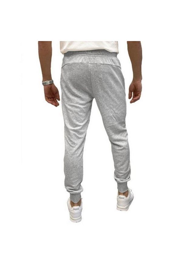 Puma - Spodnie Do Joggingu Męskie Logo ESS. Kolor: szary. Materiał: dresówka. Sport: bieganie