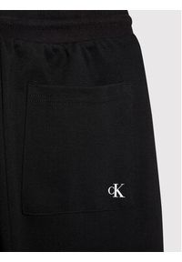 Calvin Klein Jeans Spodnie dresowe Shadow Logo IB0IB01010 Czarny Regular Fit. Kolor: czarny. Materiał: syntetyk #4