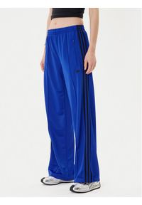 Adidas - adidas Spodnie dresowe adicolor Classic Firebird JY2693 Niebieski Loose Fit. Kolor: niebieski. Materiał: syntetyk #1