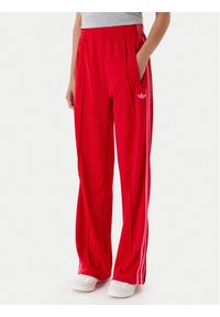 Adidas - adidas Spodnie dresowe adicolor Classic Firebird JW1225 Czerwony Loose Fit. Kolor: czerwony. Materiał: syntetyk