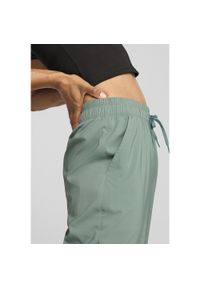 Puma - Damskie spodnie LACE PUMA Green Moon. Stan: podwyższony. Kolor: zielony. Sport: joga i pilates #1