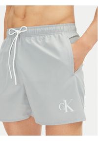 Calvin Klein Swimwear Szorty kąpielowe KM0KM01101 Niebieski Regular Fit. Kolor: niebieski. Materiał: syntetyk