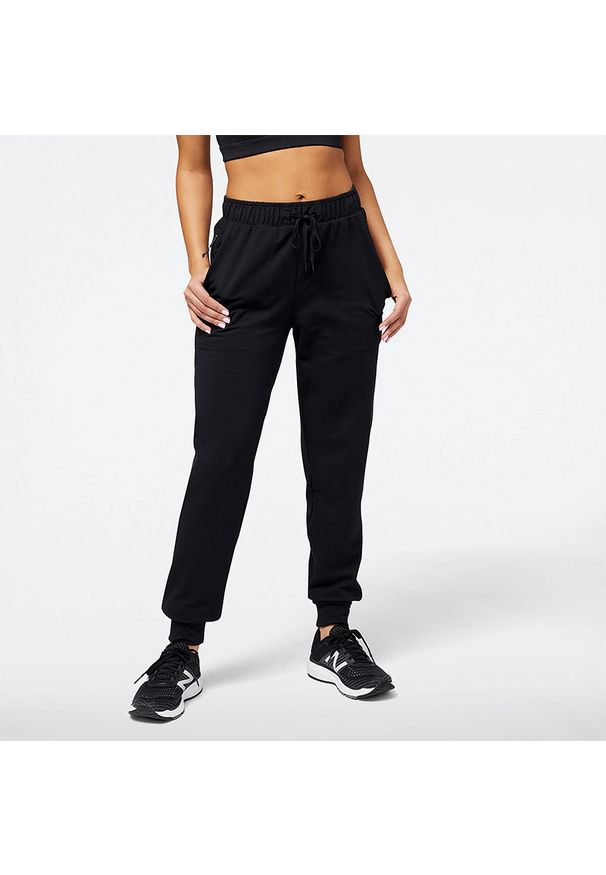 Spodnie damskie New Balance WP23287BK – czarne. Kolor: czarny. Materiał: tkanina, poliester, materiał, dresówka, skóra. Sport: fitness