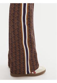 Lacoste Spodnie dresowe XF9313 Brązowy Regular Fit. Kolor: brązowy. Materiał: syntetyk #3
