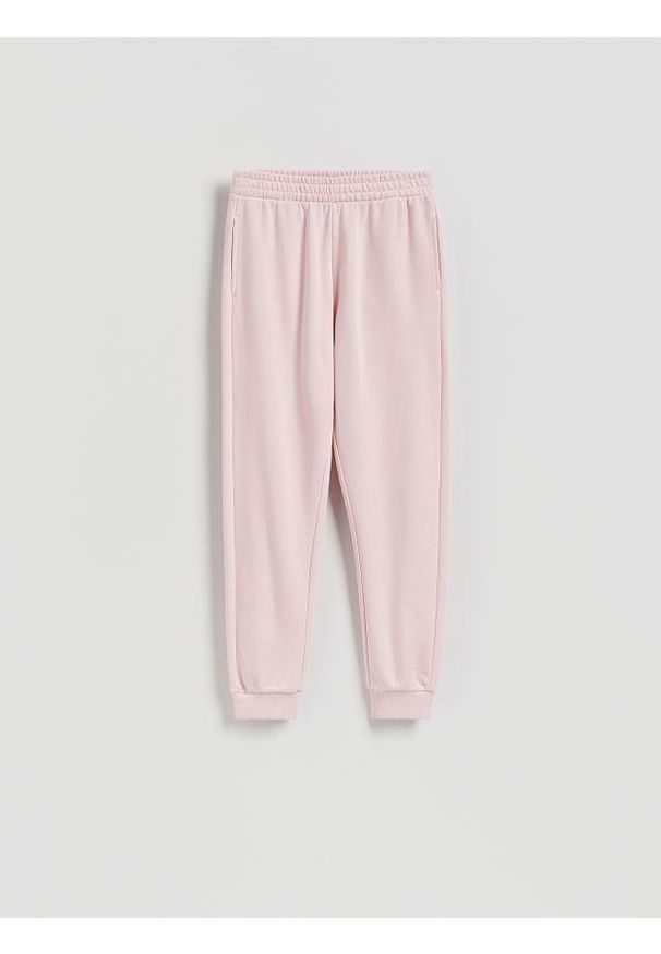Reserved - Spodnie dresowe ze ściągaczem - pastelowy róż. Kolor: różowy. Materiał: dresówka