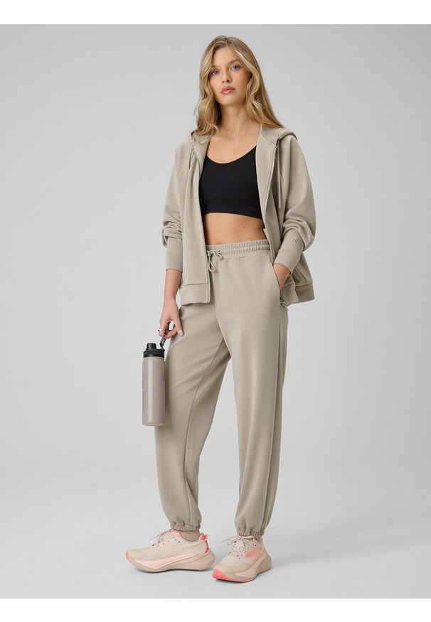 4f - 4F Spodnie z szerokimi nogawkami z modalem damskie - beżowe S. Kolor: beżowy. Materiał: dzianina, materiał, dresówka. Długość: do kostek. Wzór: gładki