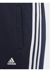 Adidas - adidas Spodnie dresowe Essentials 3-Stripes IC6128 Granatowy Slim Fit. Kolor: niebieski. Materiał: bawełna #3