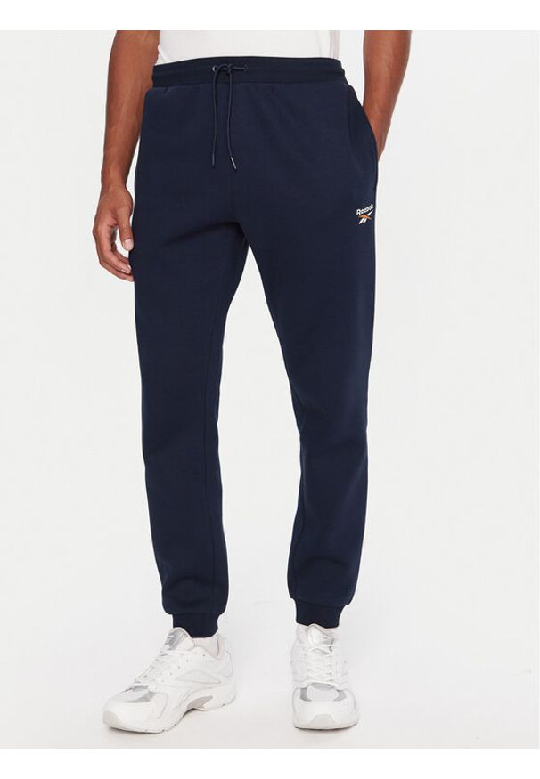 Reebok Spodnie dresowe RK25146CCM Granatowy Regular Fit. Kolor: niebieski. Materiał: syntetyk, bawełna