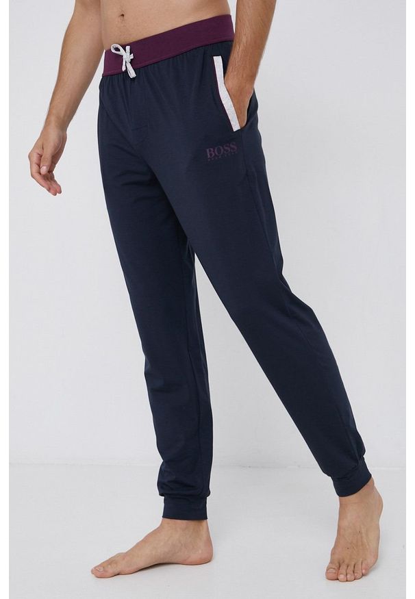 BOSS - Boss Spodnie piżamowe męskie kolor granatowy gładkie. Kolor: niebieski. Wzór: gładki