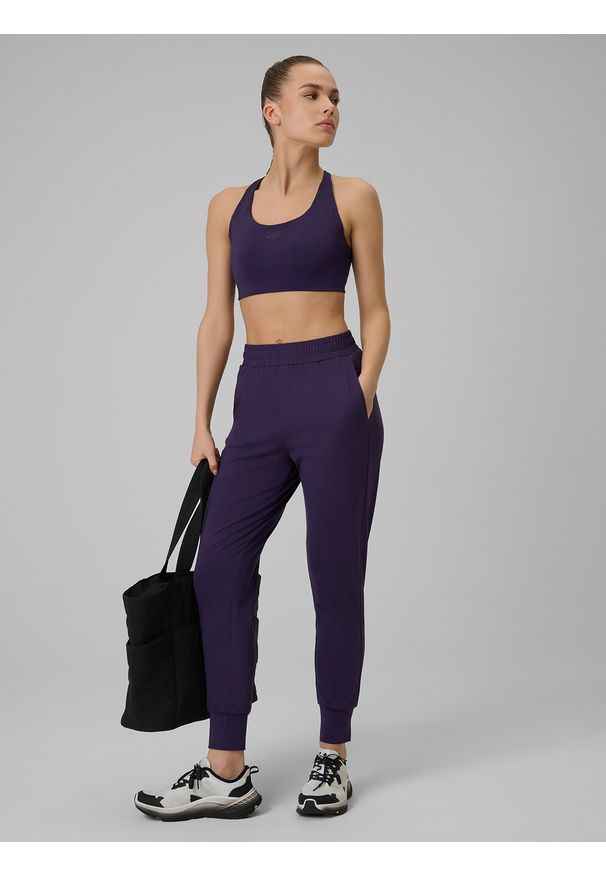 4f - 4F Spodnie treningowe szybkoschnące damskie - fioletowe L. Kolor: fioletowy. Materiał: włókno. Sport: fitness