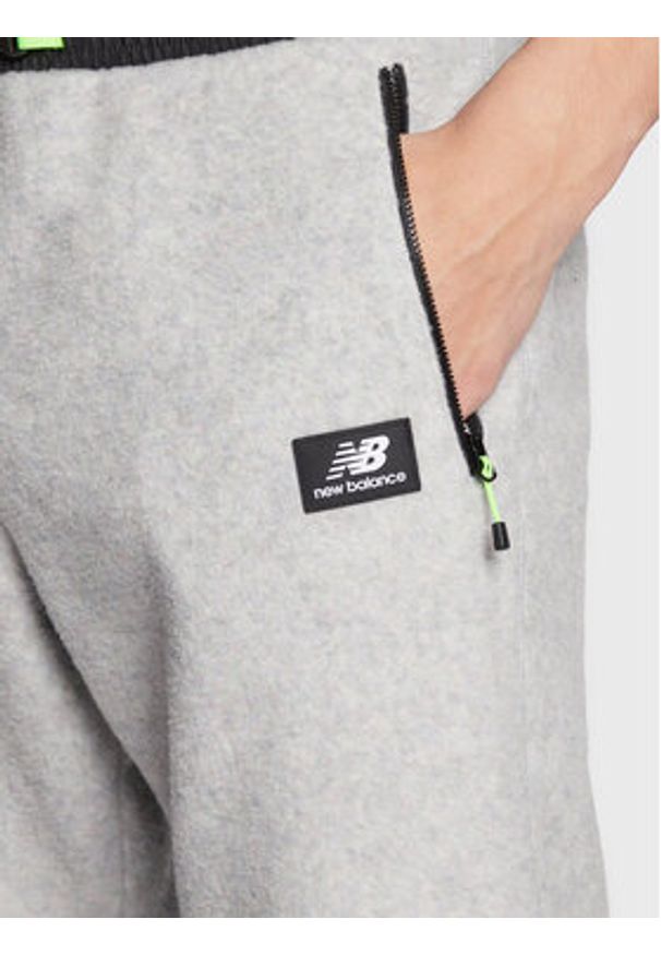 New Balance Spodnie dresowe All Terrain Spinnex MP23509 Szary Relaxed Fit. Kolor: szary. Materiał: dresówka, syntetyk