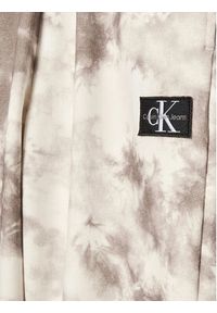 Calvin Klein Jeans Spodnie dresowe IB0IB01602 Beżowy Regular Fit. Kolor: beżowy. Materiał: bawełna