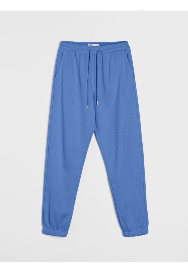 Sinsay - Dresowe spodnie jogger terry - niebieski. Kolor: niebieski. Materiał: dresówka