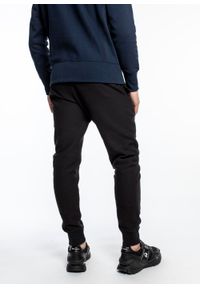 Spodnie dresowe męskie Champion Reverse Weave Cuffed Joggers (215162-KK001). Kolor: czarny. Materiał: dresówka #5