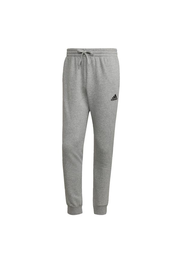 Adidas - Essentials Fleece Regular Tapered Pants. Kolor: wielokolorowy, czarny, szary. Materiał: bawełna, materiał, poliester. Sport: joga i pilates