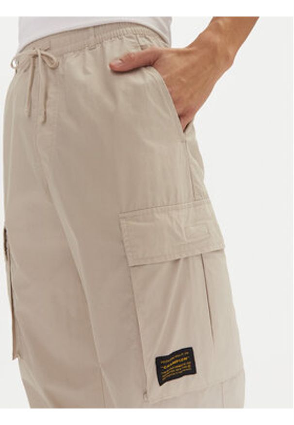 Champion Spodnie dresowe 220415 Écru Loose Fit. Materiał: bawełna