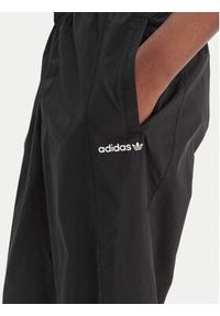 Adidas - adidas Spodnie dresowe Blocked Washed KE5037 Szary Loose Fit. Kolor: szary. Materiał: syntetyk #4