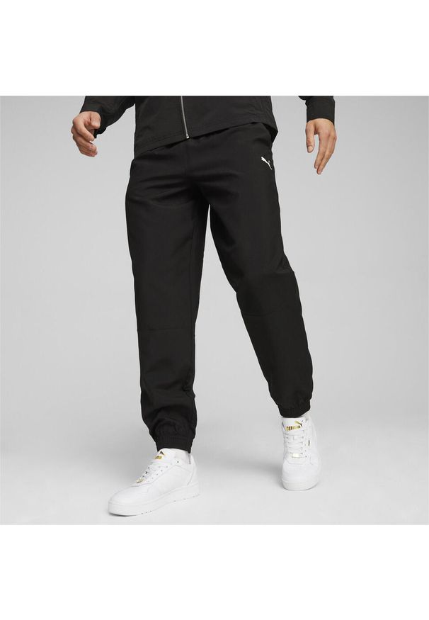 Spodnie sportowe męskie Puma Woven. Kolor: czarny