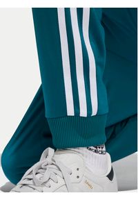 Adidas - adidas Spodnie dresowe adicolor SST IY7463 Turkusowy Regular Fit. Kolor: turkusowy. Materiał: syntetyk #2