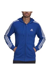 Adidas - Bluza adidas Essentials French Terry 3-Stripes Full-Zip Hoodie HE4427 - granatowa. Okazja: na uczelnię, do domu, na spacer. Typ kołnierza: kaptur. Kolor: niebieski. Materiał: poliester, materiał, bawełna, wiskoza. Wzór: paski. Styl: sportowy, klasyczny. Sport: turystyka piesza