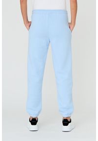 Juicy Couture - JUICY COUTURE Błękitne spodnie Heart Diamante. Kolor: niebieski. Materiał: bawełna. Wzór: aplikacja