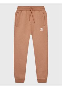Adidas - adidas Spodnie dresowe IC6134 Różowy Regular Fit. Kolor: brązowy. Materiał: bawełna