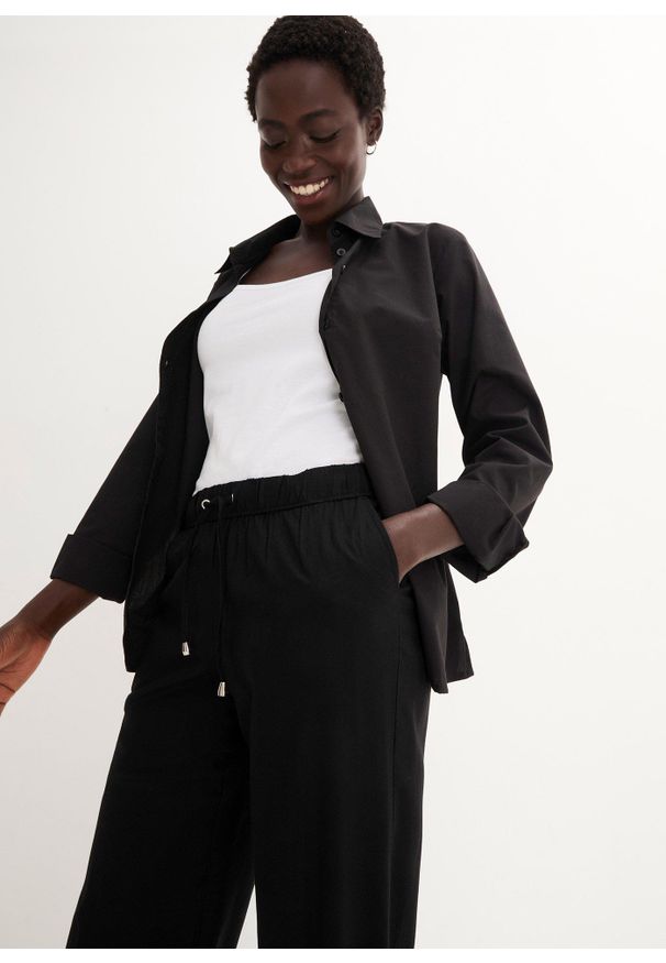 bonprix - Spodnie z gumką w talii, z wiskozy. Kolor: czarny. Materiał: wiskoza. Wzór: nadruk