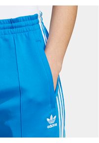 Adidas - adidas Spodnie dresowe adicolor SST IL8817 Niebieski Slim Fit. Kolor: niebieski. Materiał: bawełna