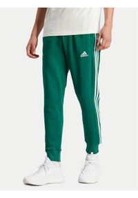 Adidas - adidas Spodnie dresowe Essentials IS1392 Zielony Regular Fit. Kolor: zielony. Materiał: bawełna