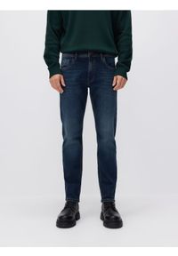 Reserved - Jeansy slim z efektem sprania - granatowy. Kolor: niebieski #1