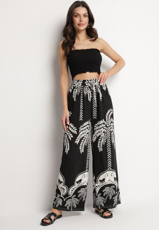 Born2be - Czarne Wiskozowe Szerokie Spodnie z Wysokim Stanem z Palmami Bolritia. Okazja: na spotkanie biznesowe, do pracy, na co dzień. Stan: podwyższony. Kolor: czarny. Materiał: wiskoza. Styl: elegancki, casual, klasyczny, biznesowy