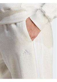 Adidas - adidas Spodnie dresowe Essentials 3-Stripes Open Hem Fleece IM0248 Écru Loose Fit. Materiał: bawełna #6