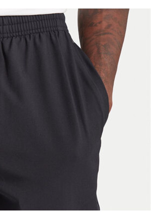 Under Armour Spodnie dresowe Unstoppable 6003861 Czarny Loose Fit. Kolor: czarny. Materiał: syntetyk