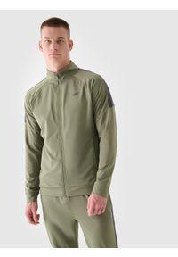 4f - Bluza treningowa szybkoschnąca męska - oliwkowa/khaki. Typ kołnierza: bez kaptura, kołnierzyk stójkowy. Kolor: brązowy, wielokolorowy, oliwkowy. Materiał: włókno, syntetyk, dzianina, elastan, materiał. Długość rękawa: raglanowy rękaw. Wzór: jednolity, gładki. Styl: sportowy. Sport: fitness