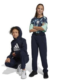 Adidas - adidas spodnie dziecięce U CE DW kolor granatowy gładkie. Kolor: niebieski. Materiał: tkanina, poliester. Wzór: gładki #1