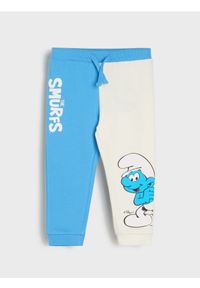 Sinsay - Spodnie The Smurfs - kremowy. Kolor: kremowy #1