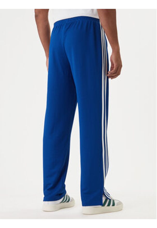 Adidas - adidas Spodnie dresowe adicolor Firebird KD4079 Niebieski Regular Fit. Kolor: niebieski. Materiał: syntetyk