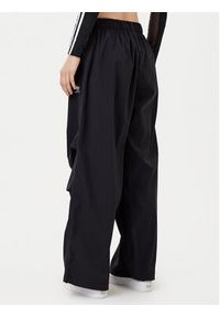 Adidas - adidas Spodnie dresowe Essentials Ripstop JD0785 Czarny Loose Fit. Kolor: czarny. Materiał: syntetyk #5