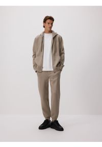 Reserved - Dresowe spodnie jogger z bawełną - brązowy. Kolor: brązowy. Materiał: bawełna, dresówka #1