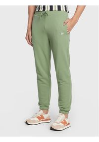 New Era Spodnie dresowe Essential 60284702 Zielony Relaxed Fit. Kolor: zielony. Materiał: syntetyk