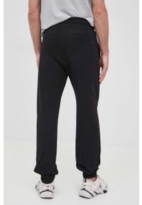 Trussardi Jeans - Trussardi spodnie bawełniane męskie kolor czarny melanżowe. Kolor: czarny. Materiał: bawełna. Wzór: melanż